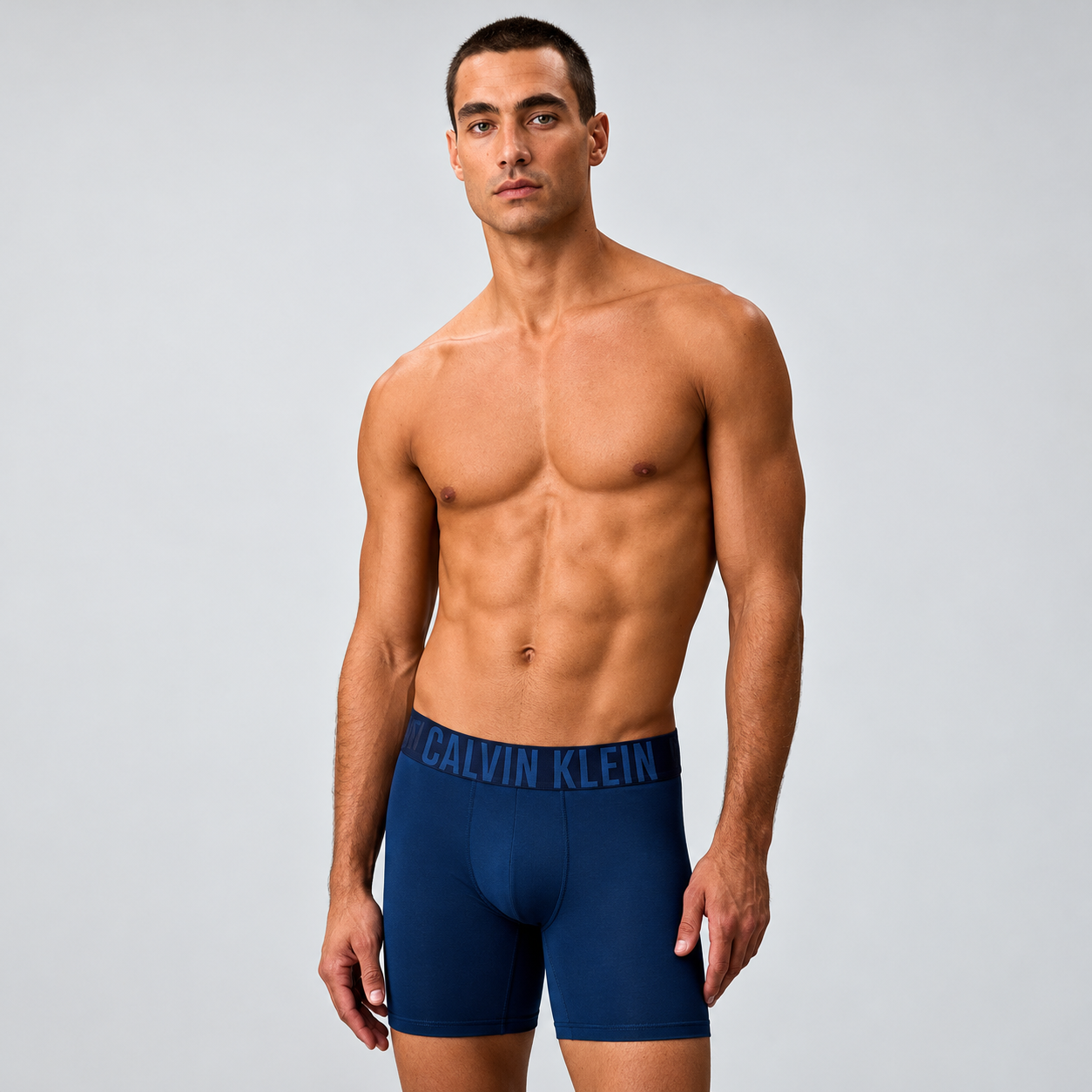 Model wearing navy boxer briefs, front view